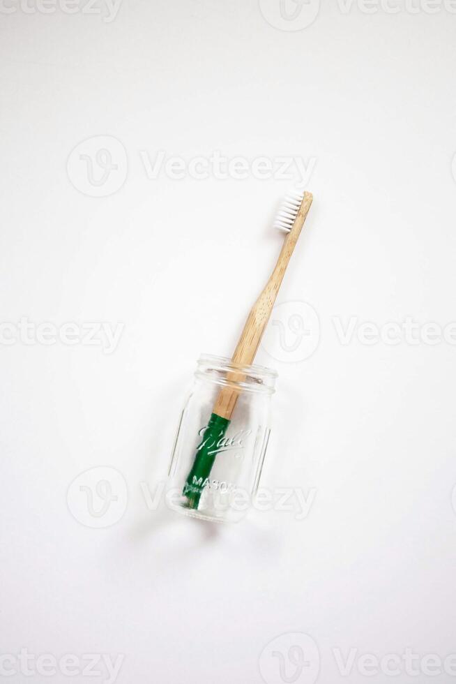 a toothbrush and toothpaste in a jar photo