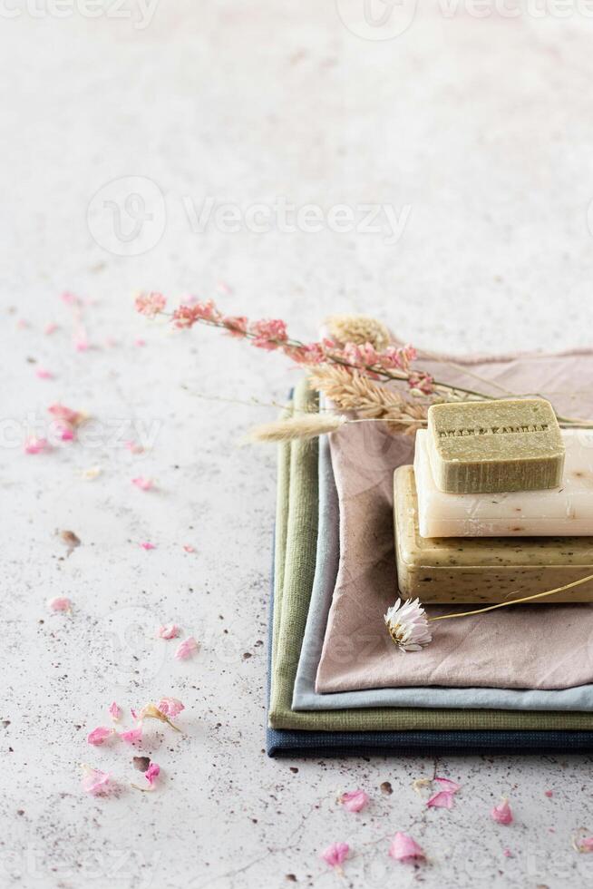 soap bars on a table with flowers and leaves photo