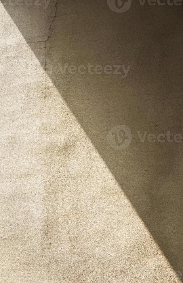 a shadow of a person standing on a wall photo
