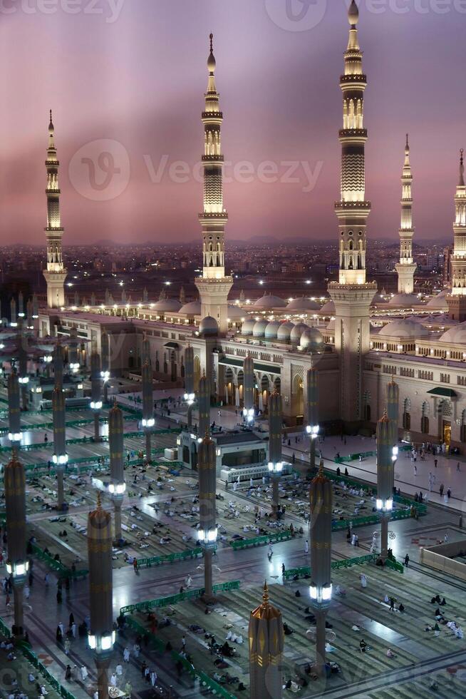a large al madinah mosque with many tall towers photo