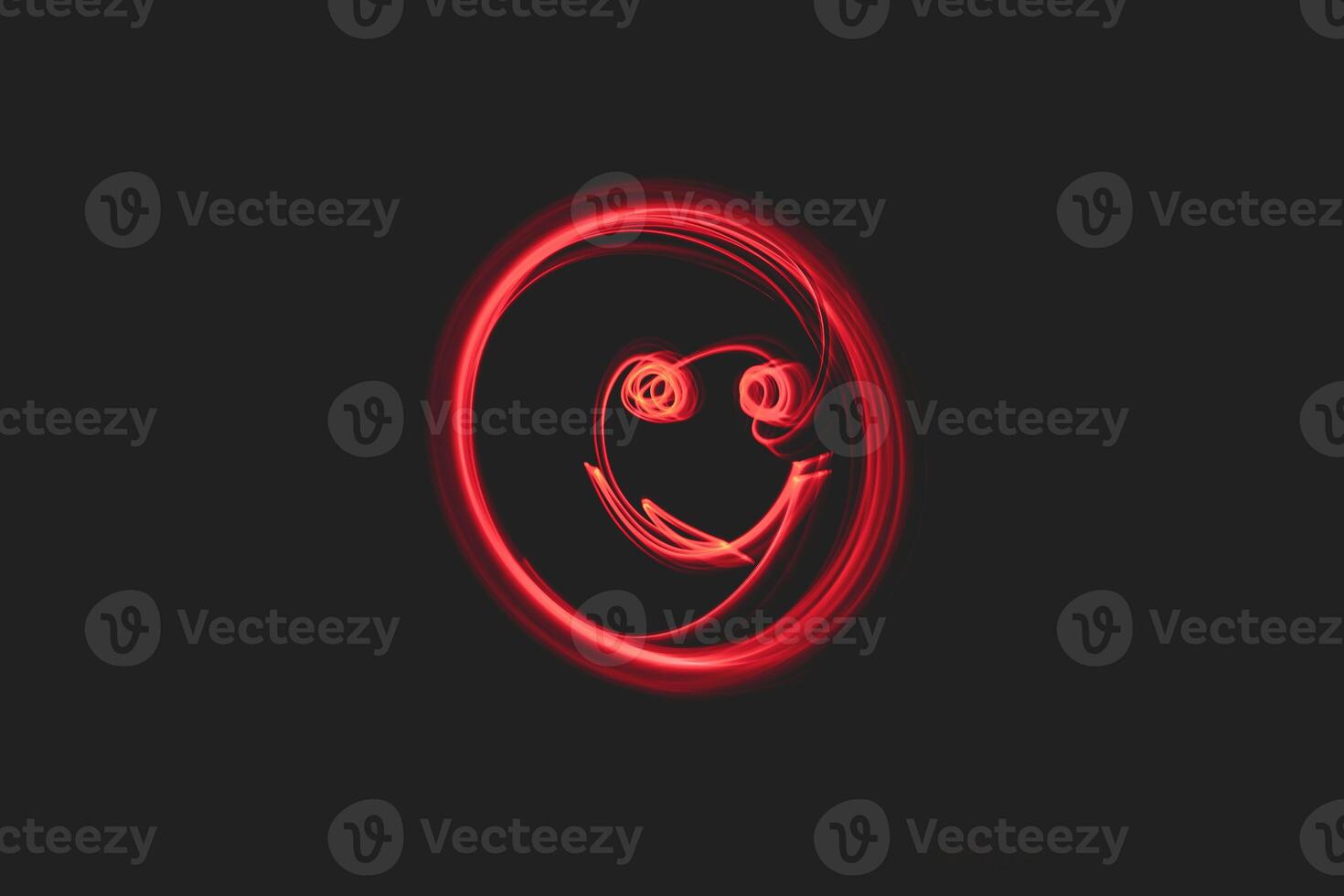 a red light painting of a smiling face photo