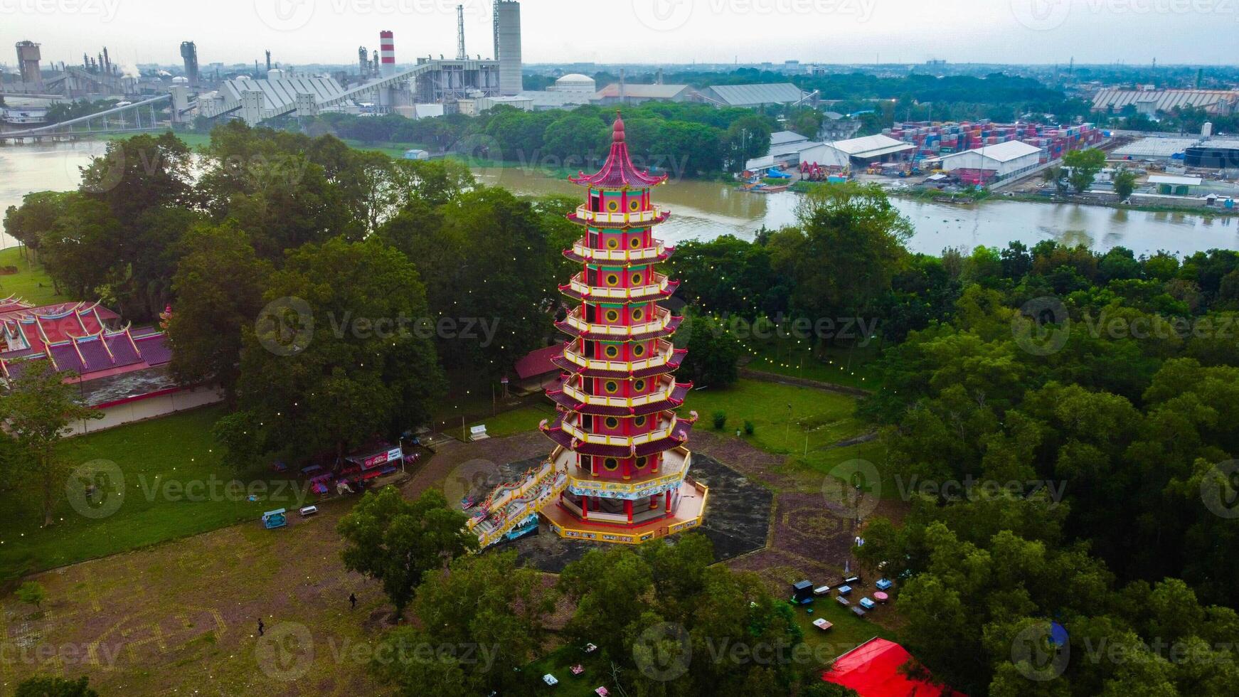 Enchanting sunset at Pulau Kemaro, Palembang. The pagoda and klenteng by the riverside offer a picturesque view, perfect for serene visuals. photo