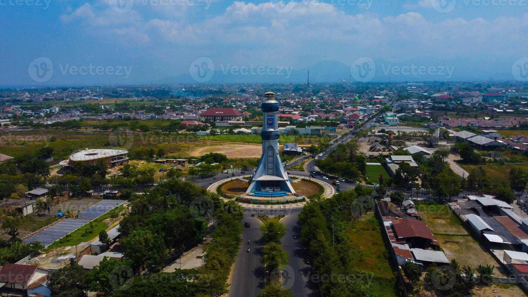 Experience the breathtaking aerial view of Lombok's city monument in the serene morning light. Witness the vibrant urban landscape awakening with life. photo