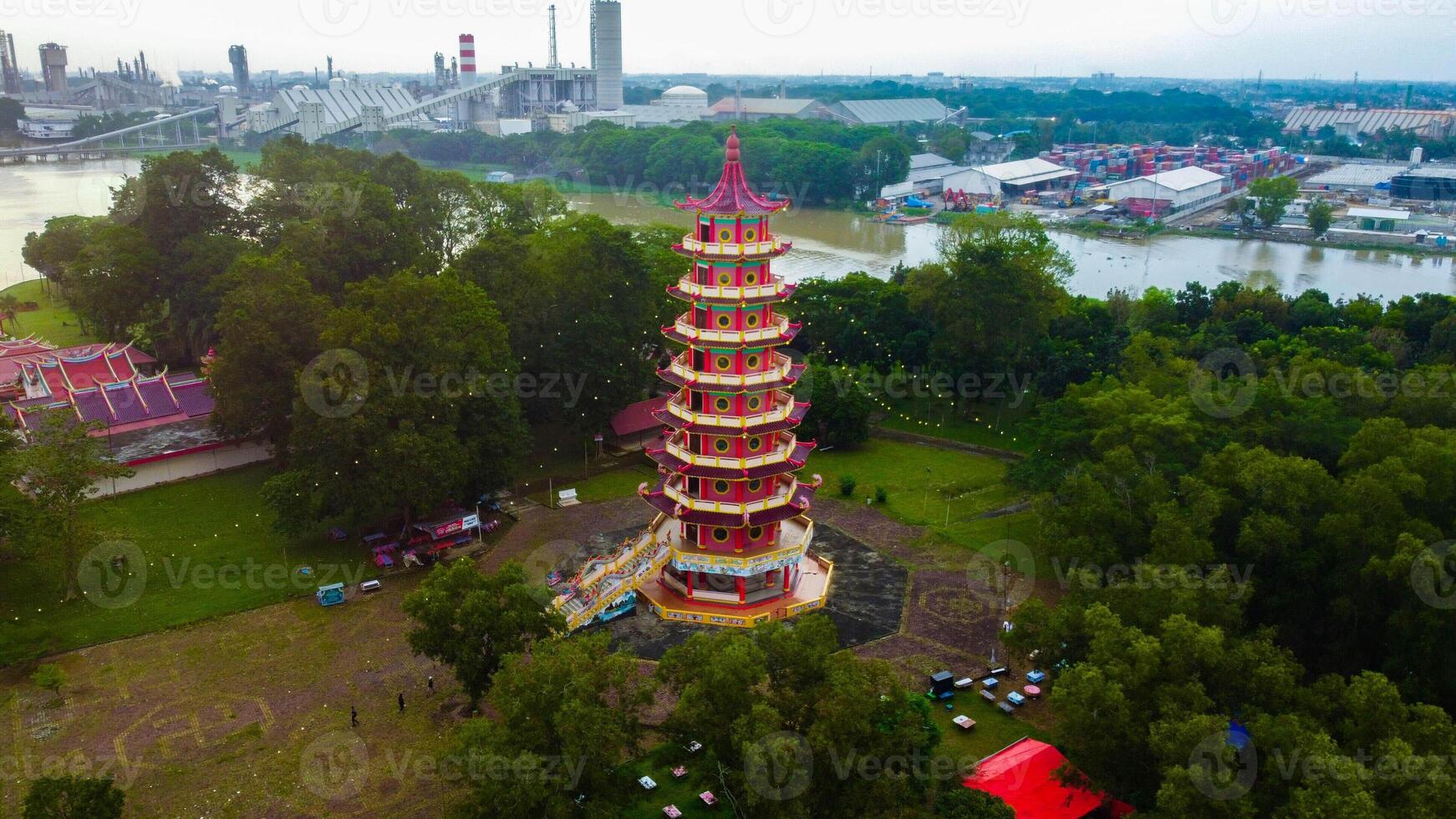 Enchanting sunset at Pulau Kemaro, Palembang. The pagoda and klenteng by the riverside offer a picturesque view, perfect for serene visuals. photo