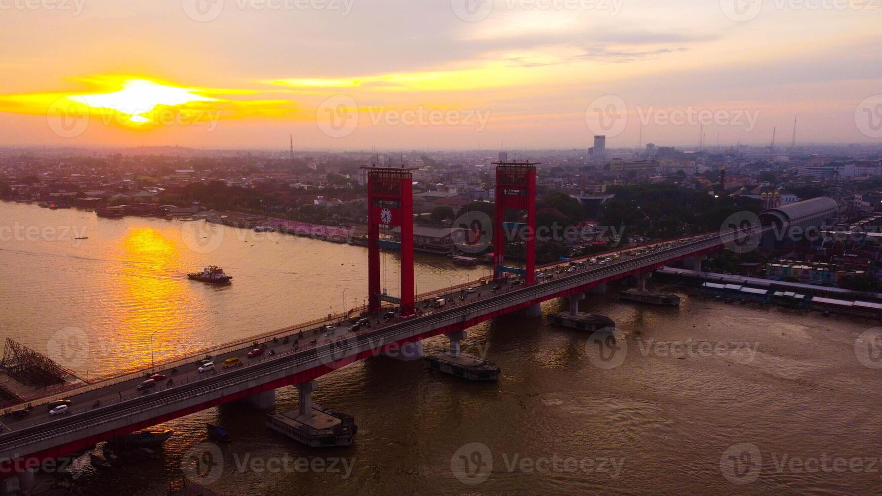 Majestic Ampera Bridge, a landmark of Palembang, towers over the river in the city center. Perfect for showcasing urban beauty and culture. photo