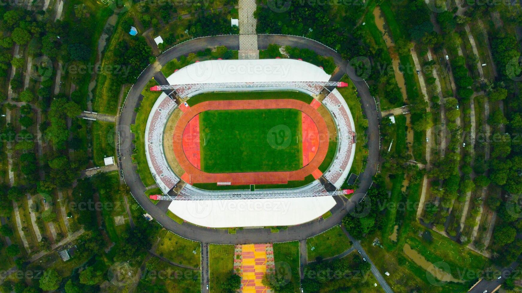 Aerial view of Palembang's largest soccer field, featuring a meticulously maintained green lawn. photo