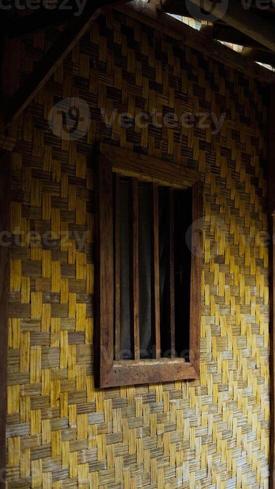 The remote Baduy village is a hidden gem, surrounded by lush greenery and dense trees. This tranquil setting offers a glimpse into a unique culture, photo