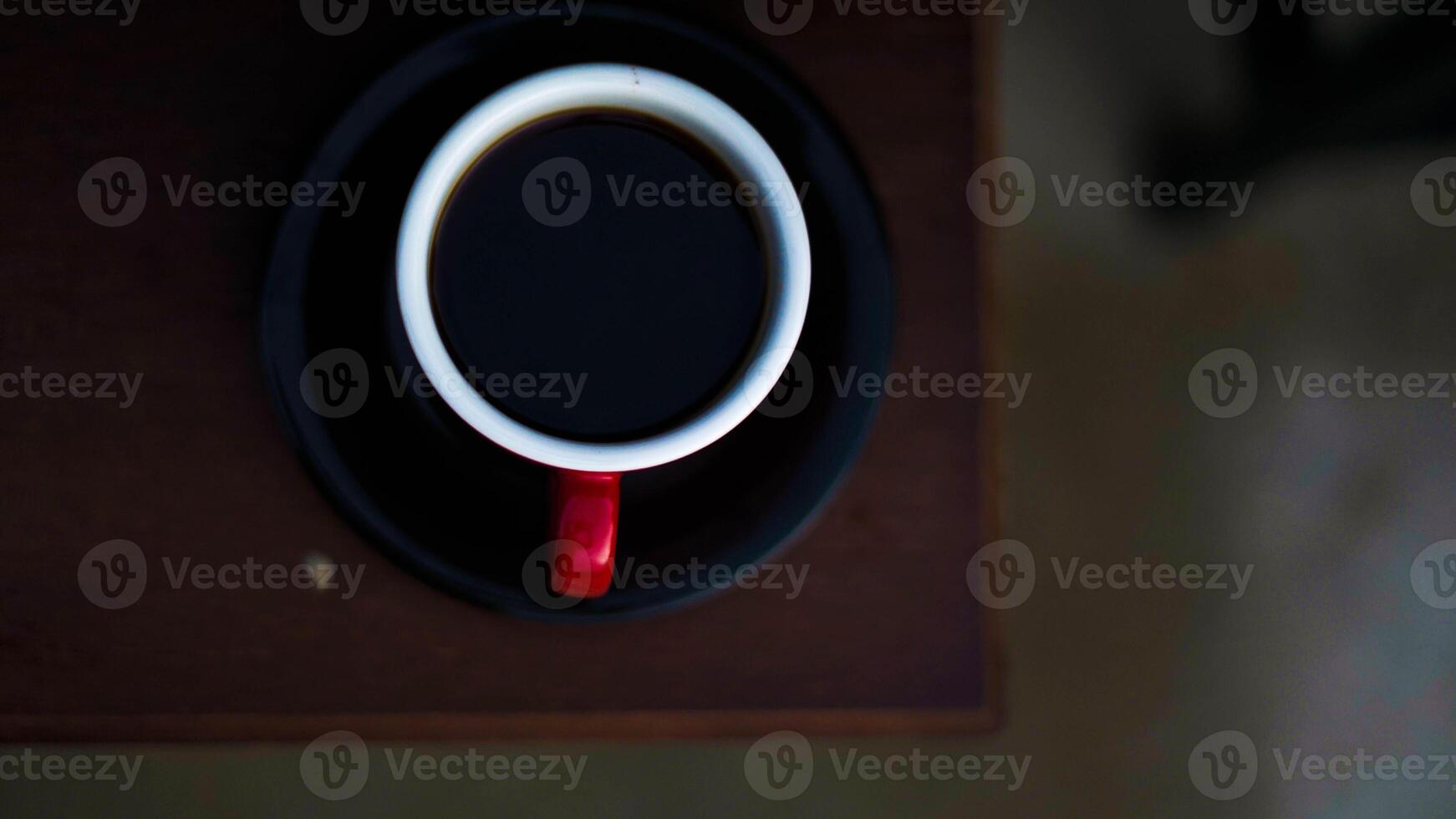A unique coffee shop buzzes with charm, featuring captivating decor and engaging facilities. It's a perfect spot for coffee lovers and social gatherings. photo