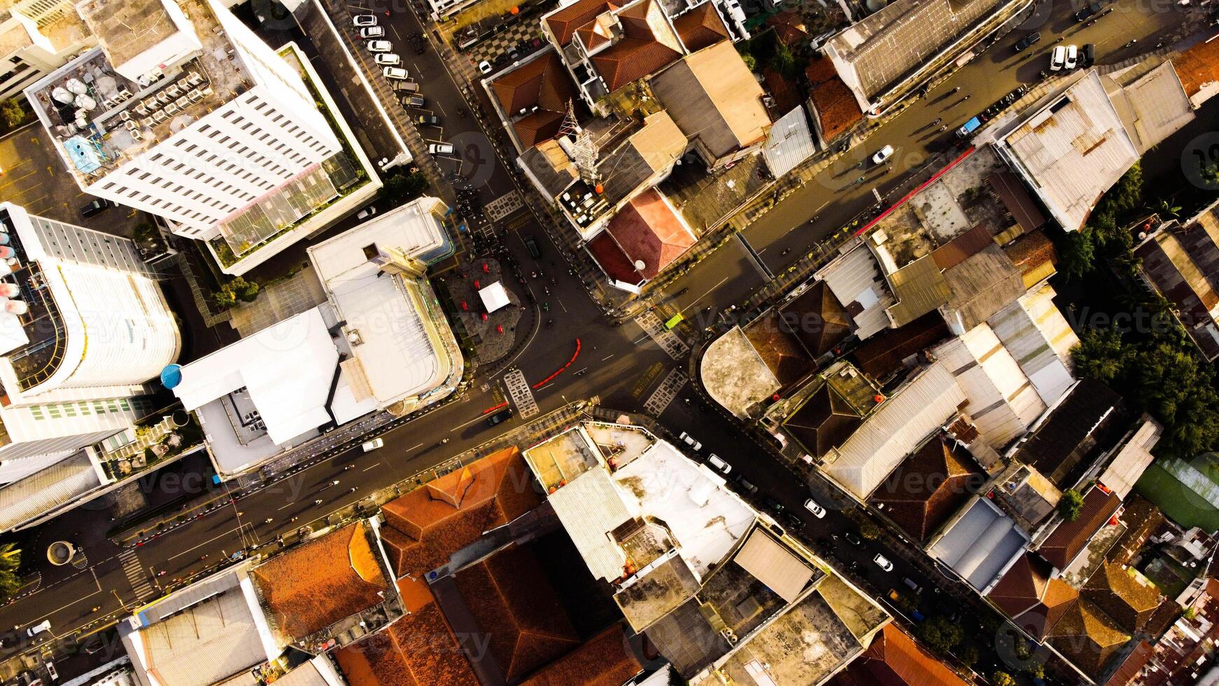 An aerial view of Braga Street captures the bustling urban landscape of Bandung in the evening. photo