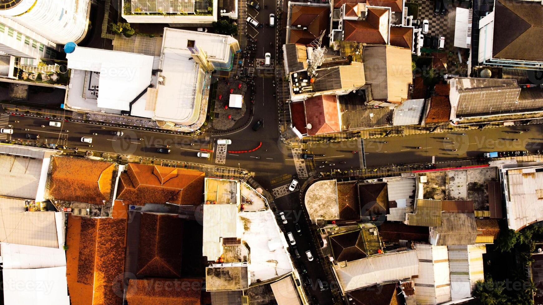 An aerial view of Braga Street captures the bustling urban landscape of Bandung in the evening. photo