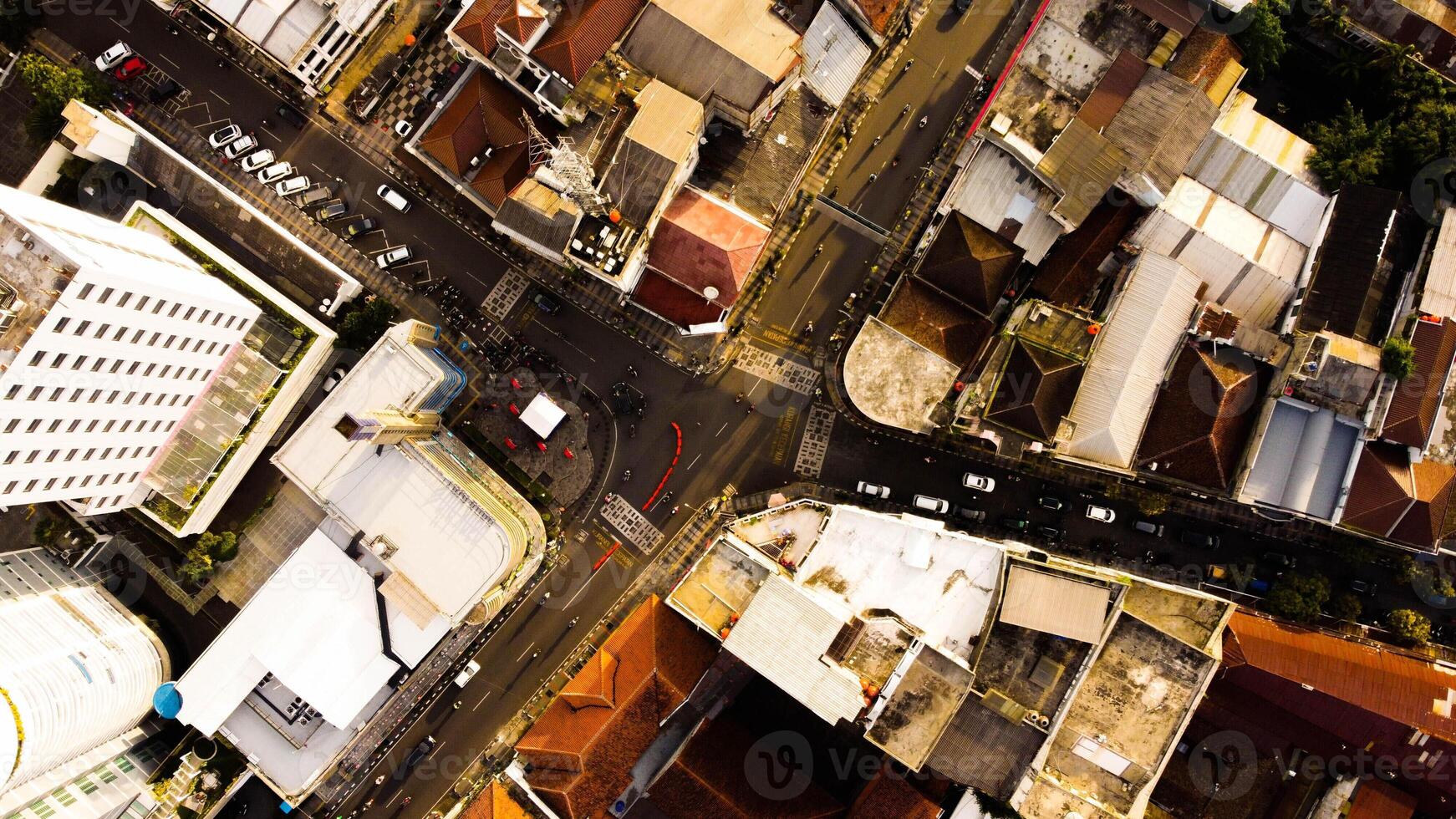 An aerial view of Braga Street captures the bustling urban landscape of Bandung in the evening. photo