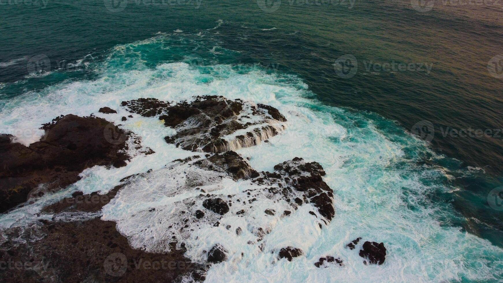 Discover breathtaking aerial views of Kenawa Island in the blue sea, featuring a small hill and vast savanna in the uninhabited area of Sumbawa, Nusa Tenggara Barat. photo