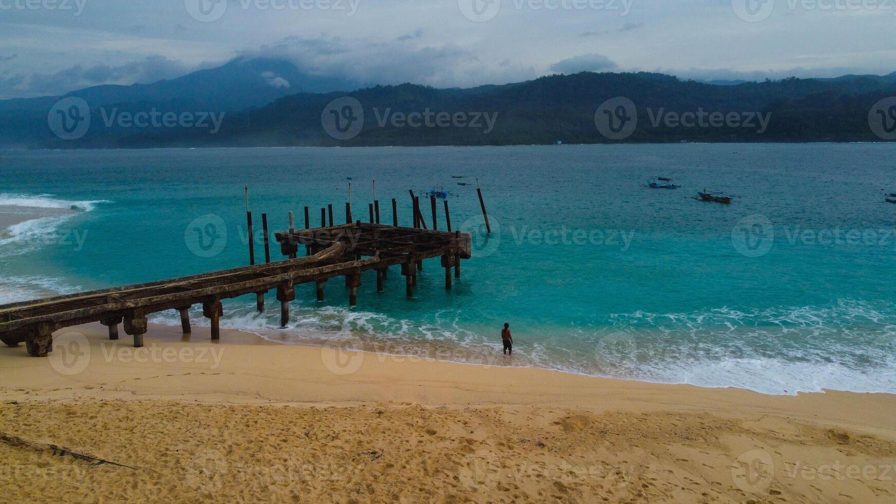 Beautiful panoramic aerial view from drone of sea bay, waves crashing on the harbor in Indonesia Mediterranean landscape, rotation, photo