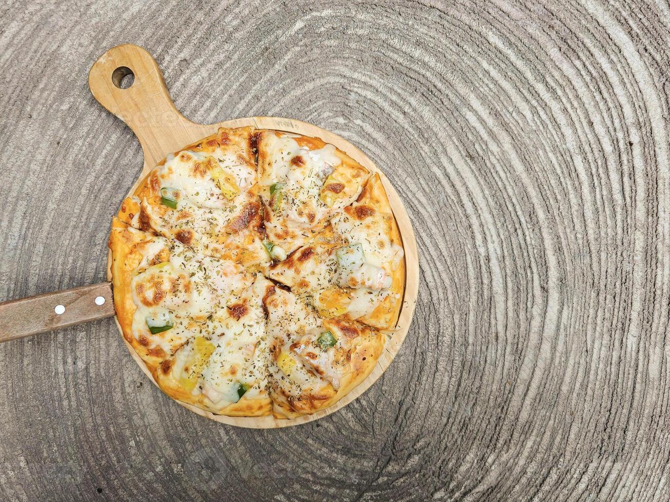 Salmon Pizza homemade on wooden board. high angle view with copy space photo