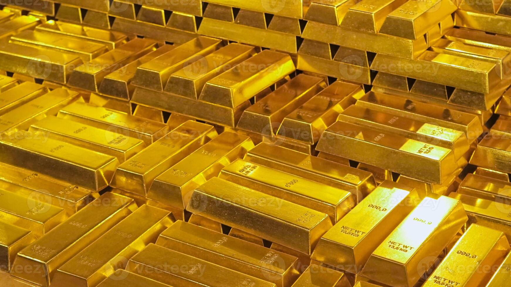 Golden bars of gold. There are many bars of gold in the image. The bars are stacked on top of each other. photo