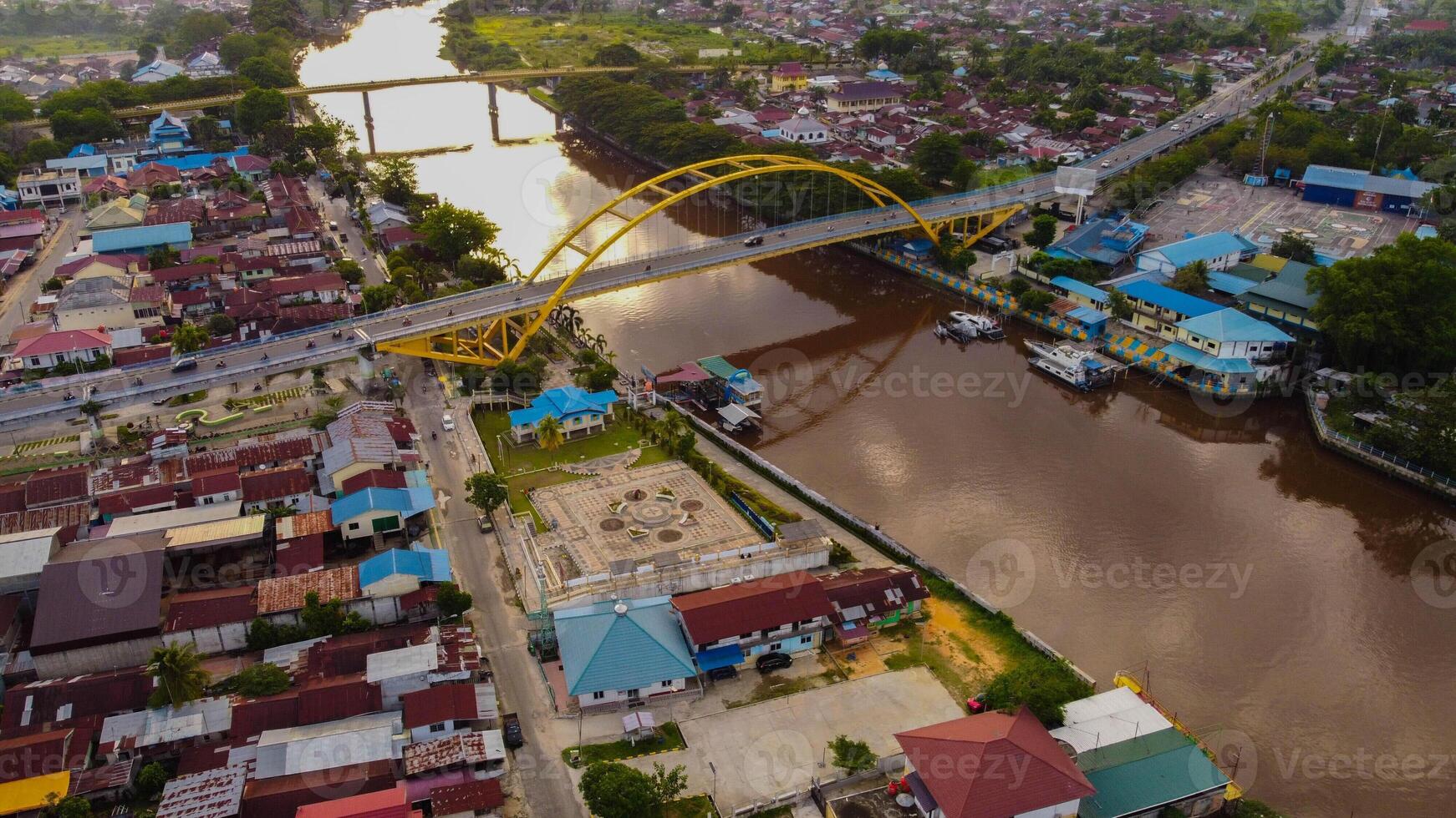 February 5, 2022. Above Pekanbaru, Riau, Indonesia. Leighton Bridge or Siak Bridge above the Siak River. Aerial footage. photo