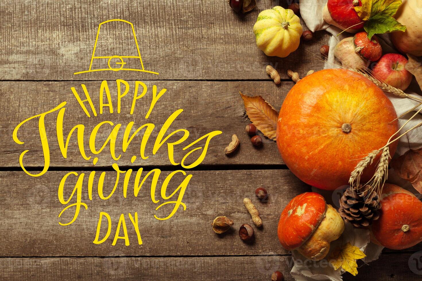 Happy thanksgiving day display on wooden background photo