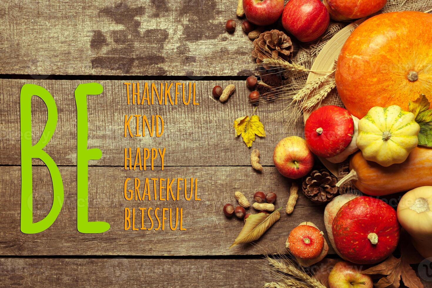 Happy thanksgiving day display on wooden background photo