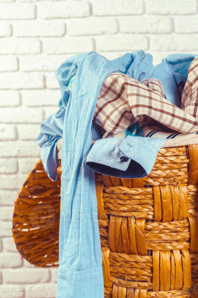 Clothes in wooden basket photo