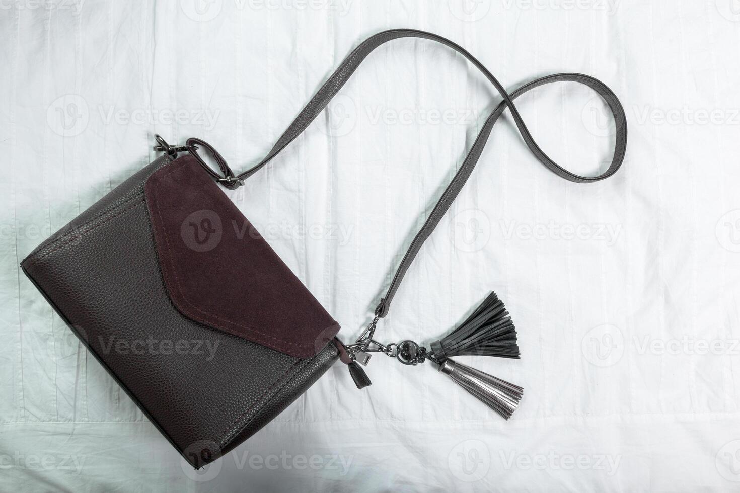 Female bag on white textile photo