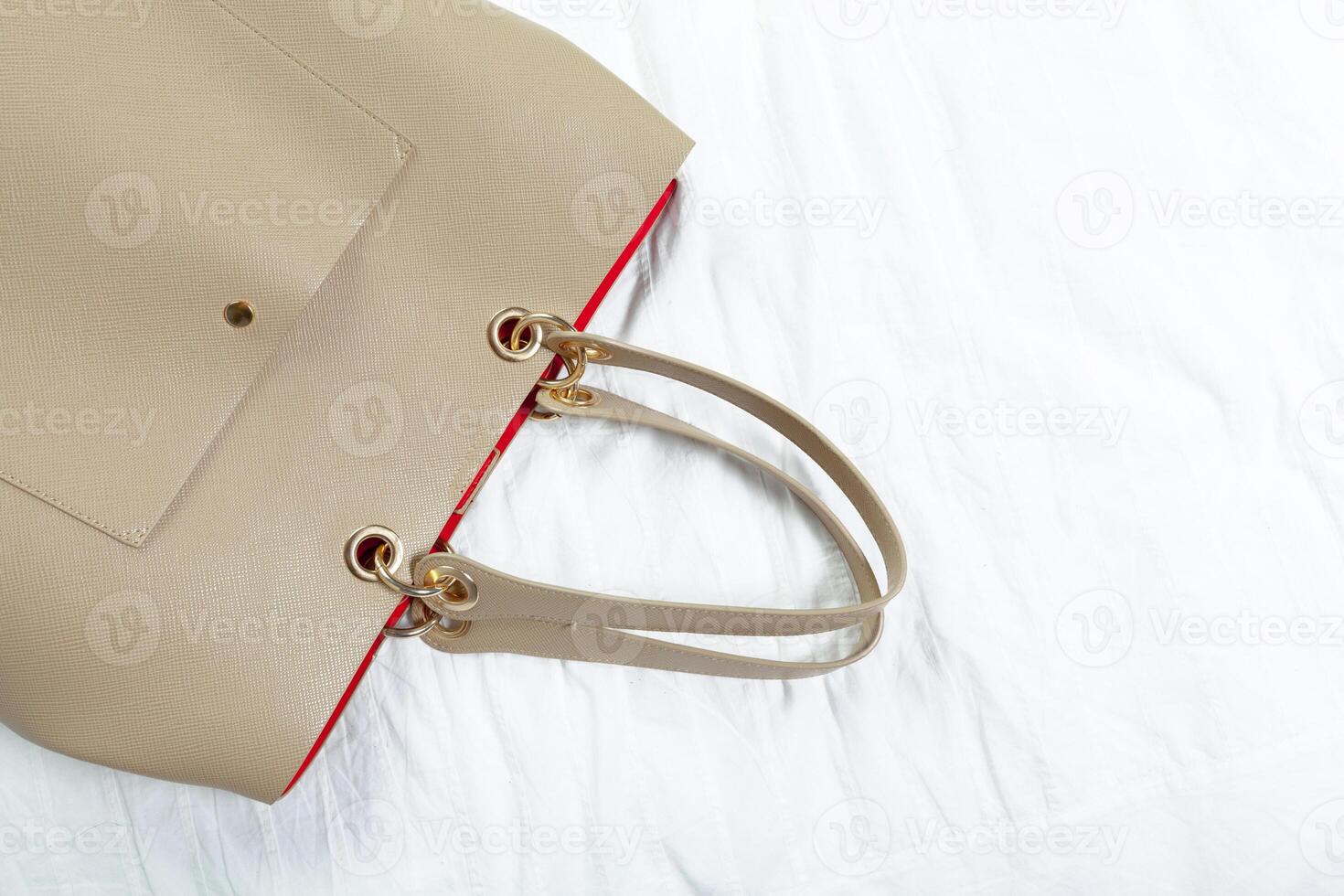 Female bag on white textile photo