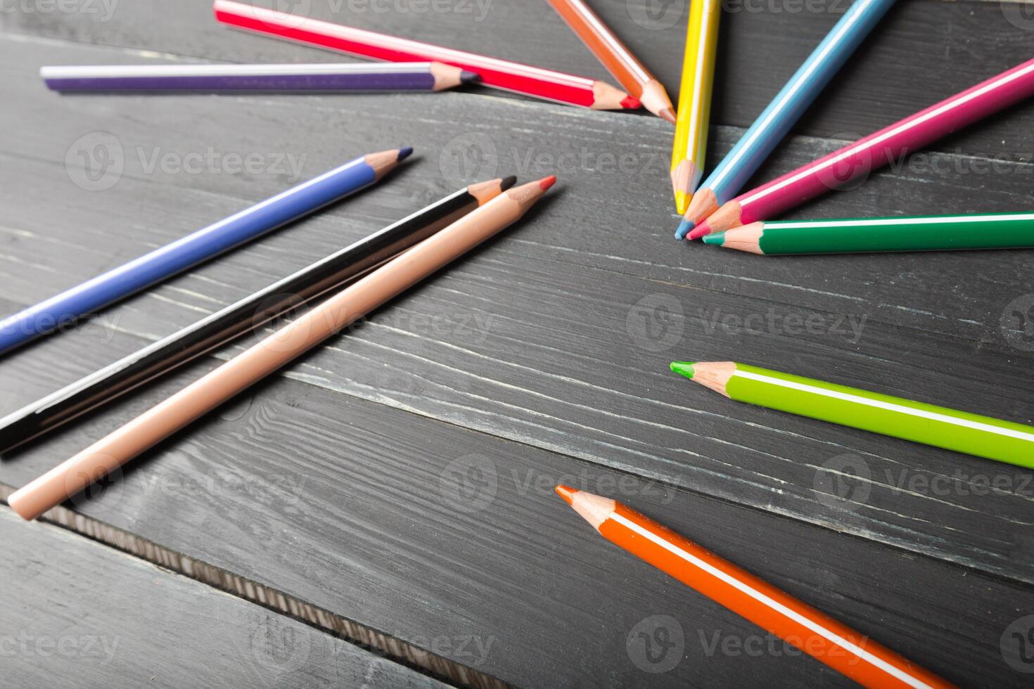 pencils on a wooden table photo