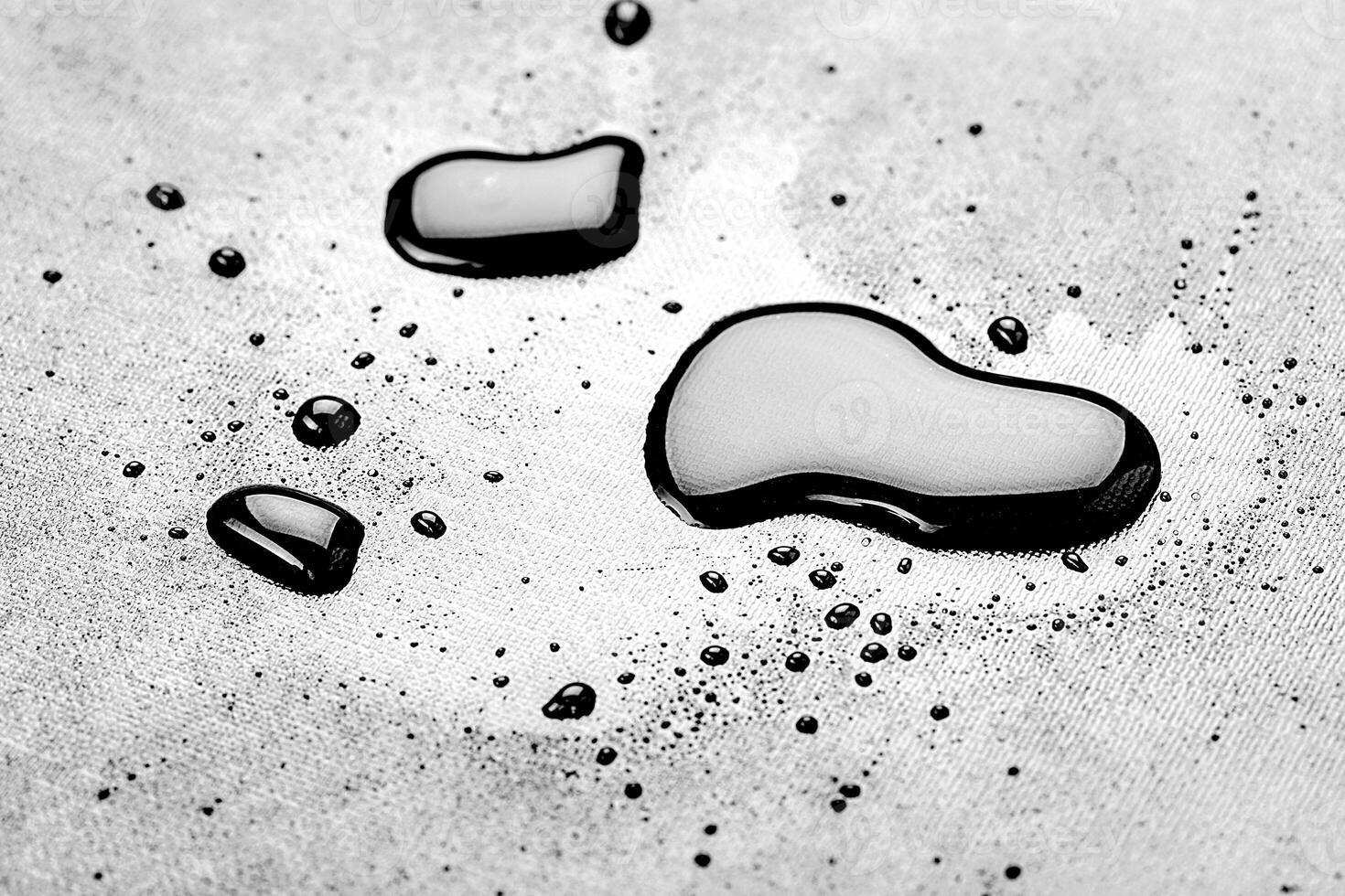 water drops splash on the black floor photo