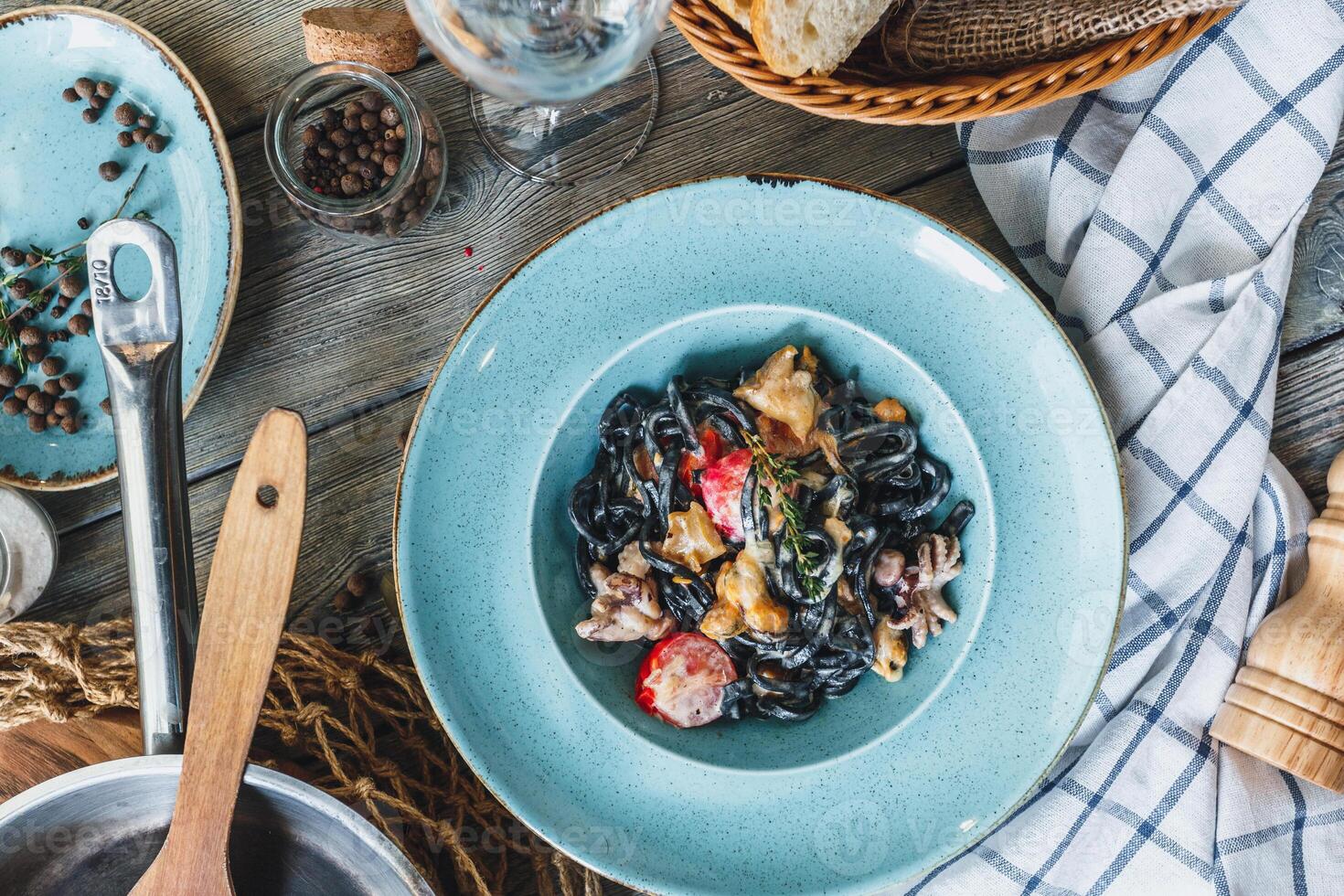 Black pasta with shrimps photo
