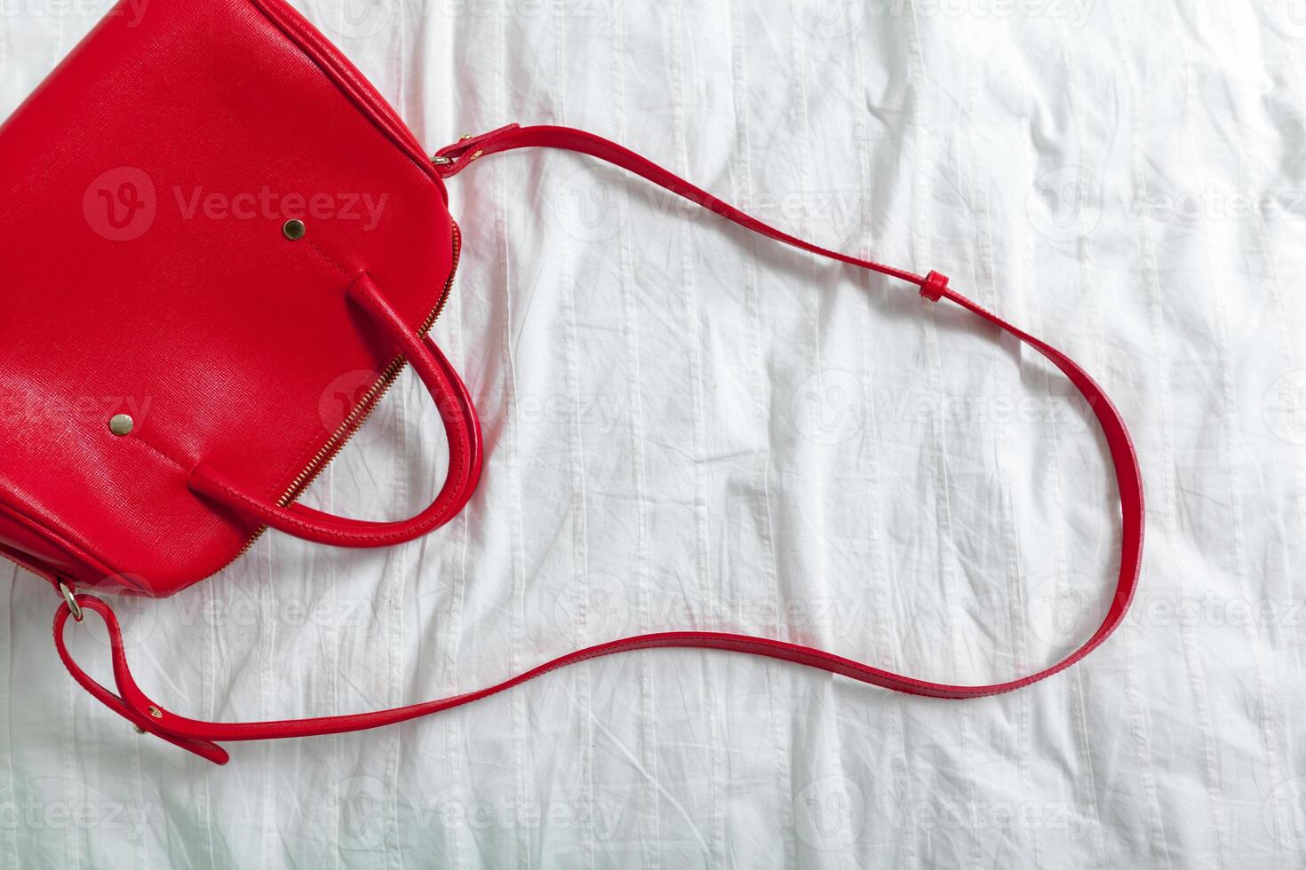 Female bag on white textile photo