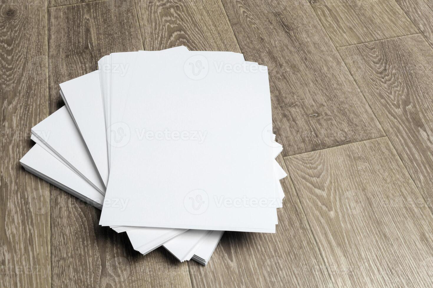 Blank paper on wood table photo