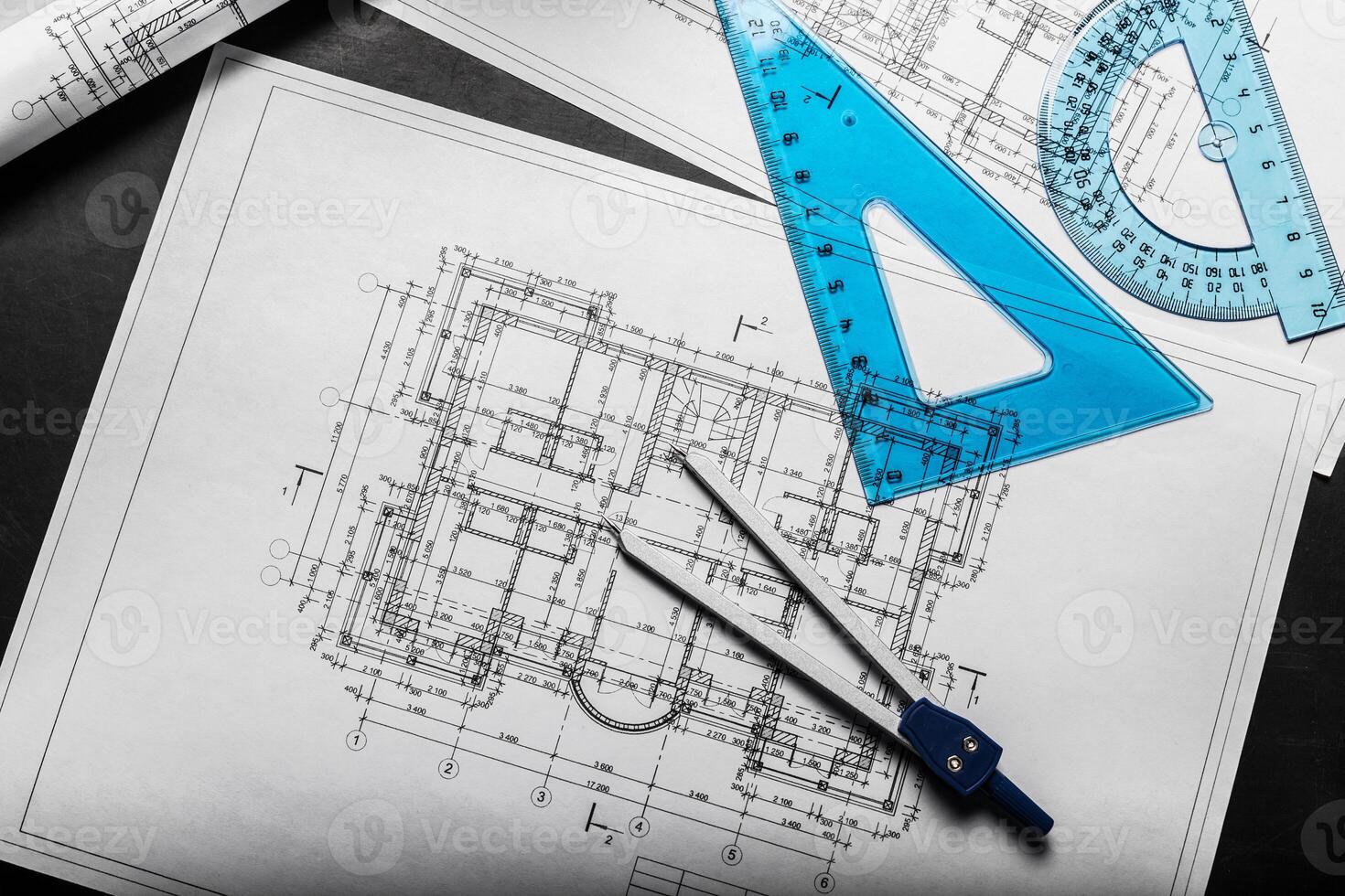 Construction planning drawings on black background photo