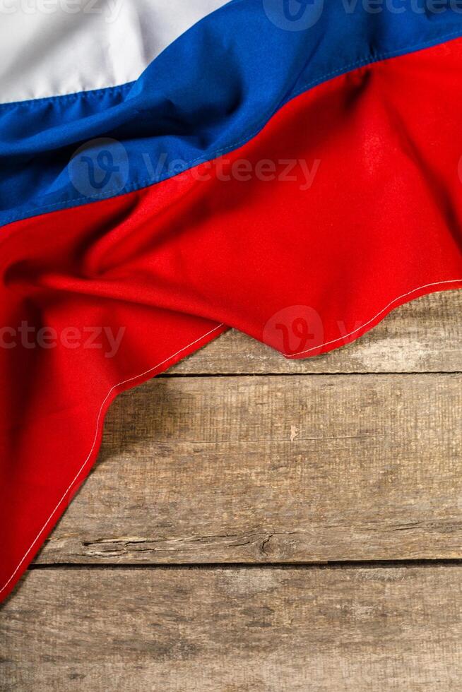 Russian flag on a wooden table. photo
