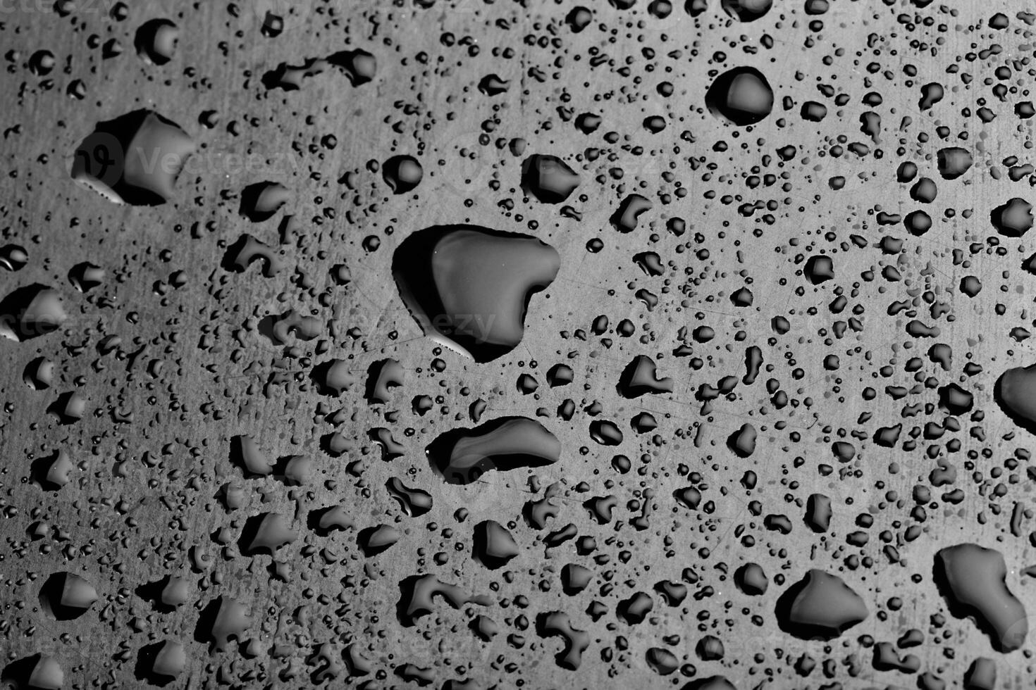 water drops splash on the black floor photo