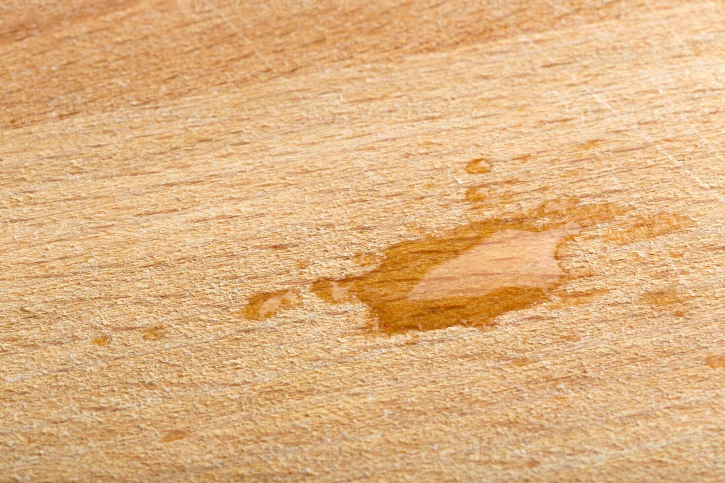 Drop of water on wooden table photo