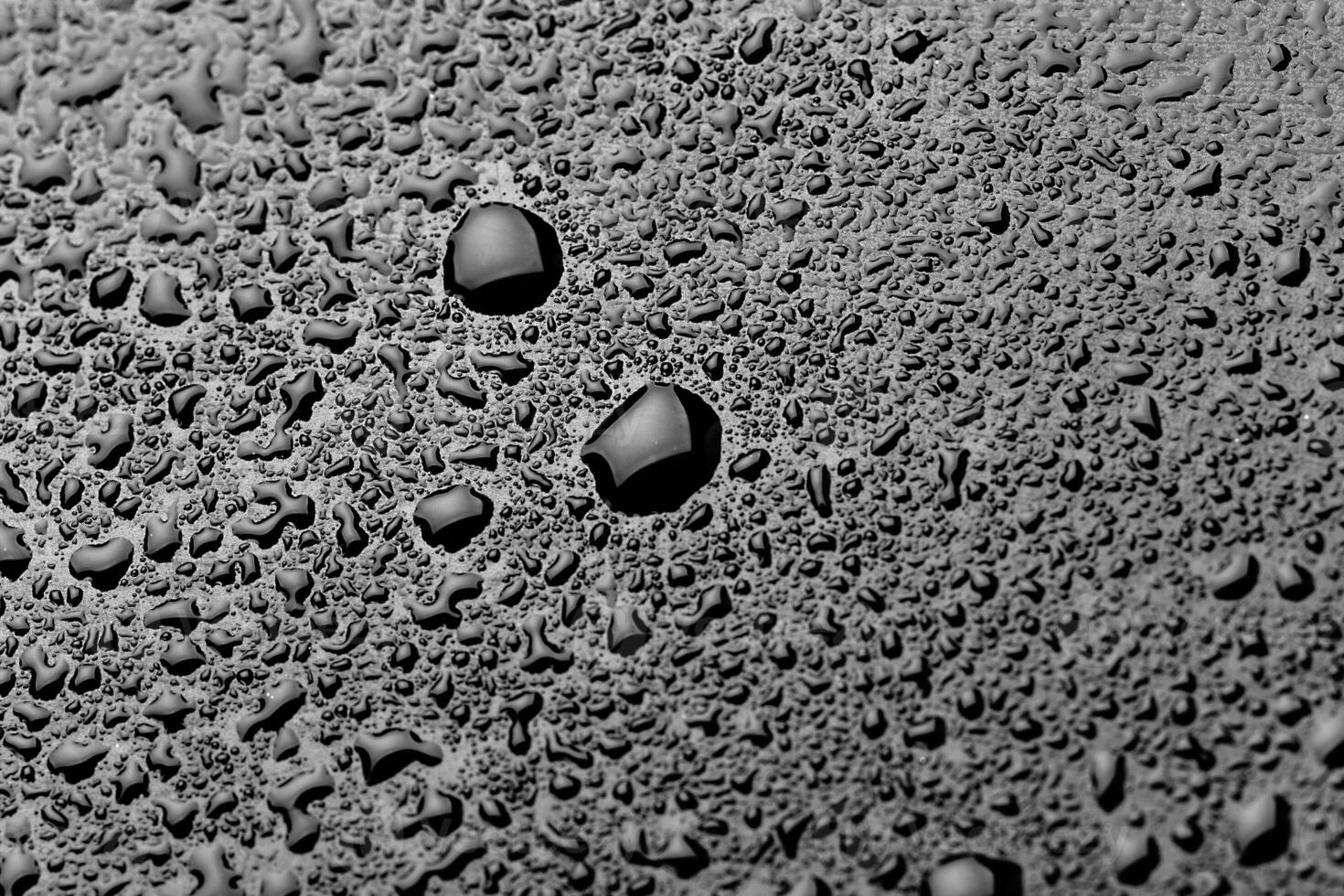 water drops splash on the black floor photo