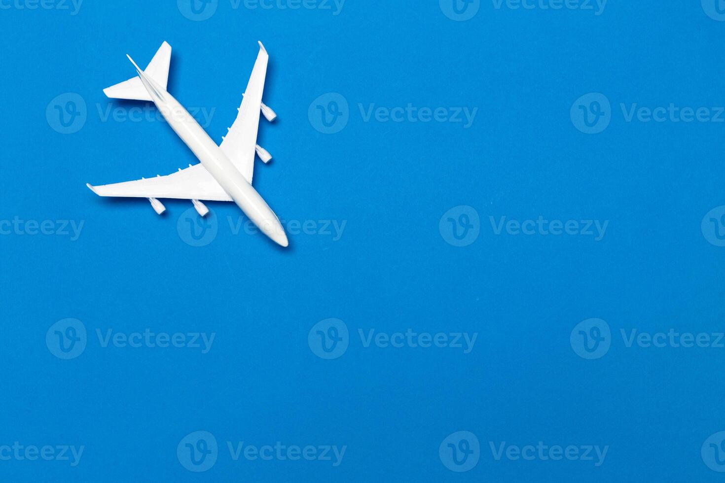 model of passenger plane on blue background photo