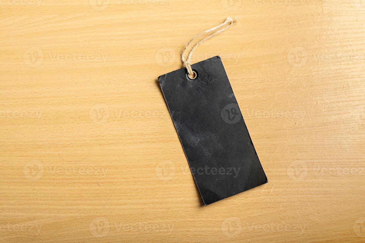 Blank tag on wooden background photo