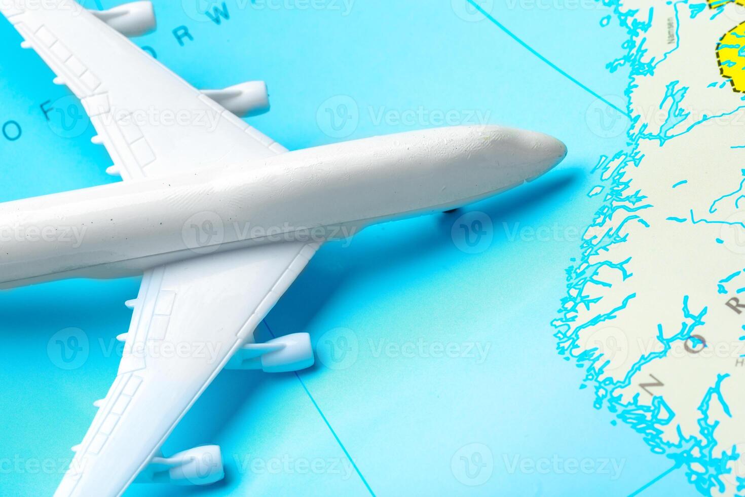 miniature of a passenger aircraft flying on a map photo