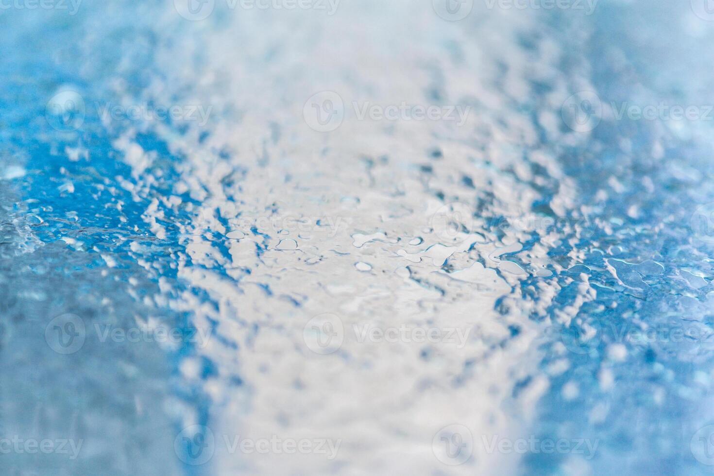 Frozen ice pattern on glass photo