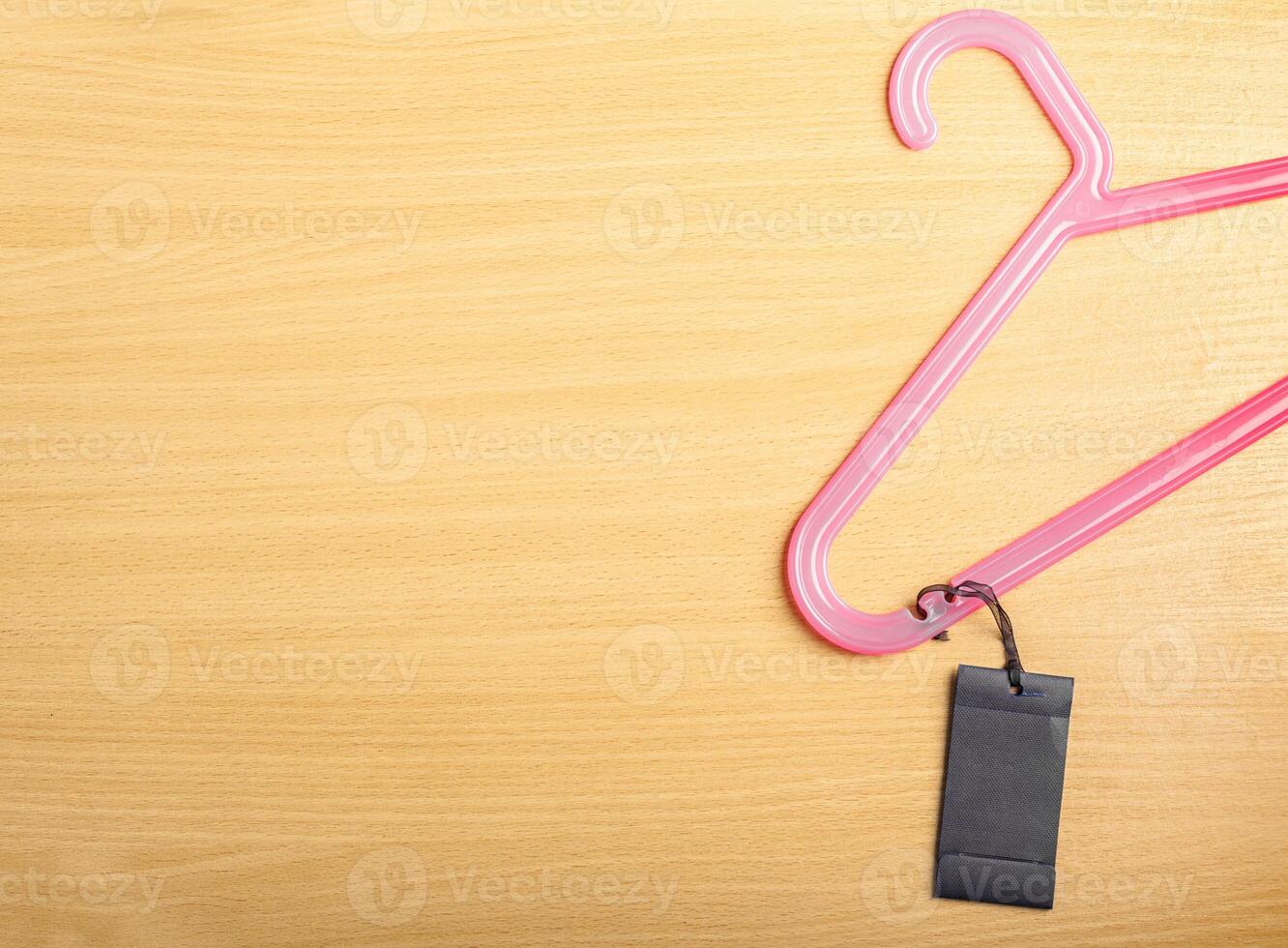 Blank tag on wooden background photo