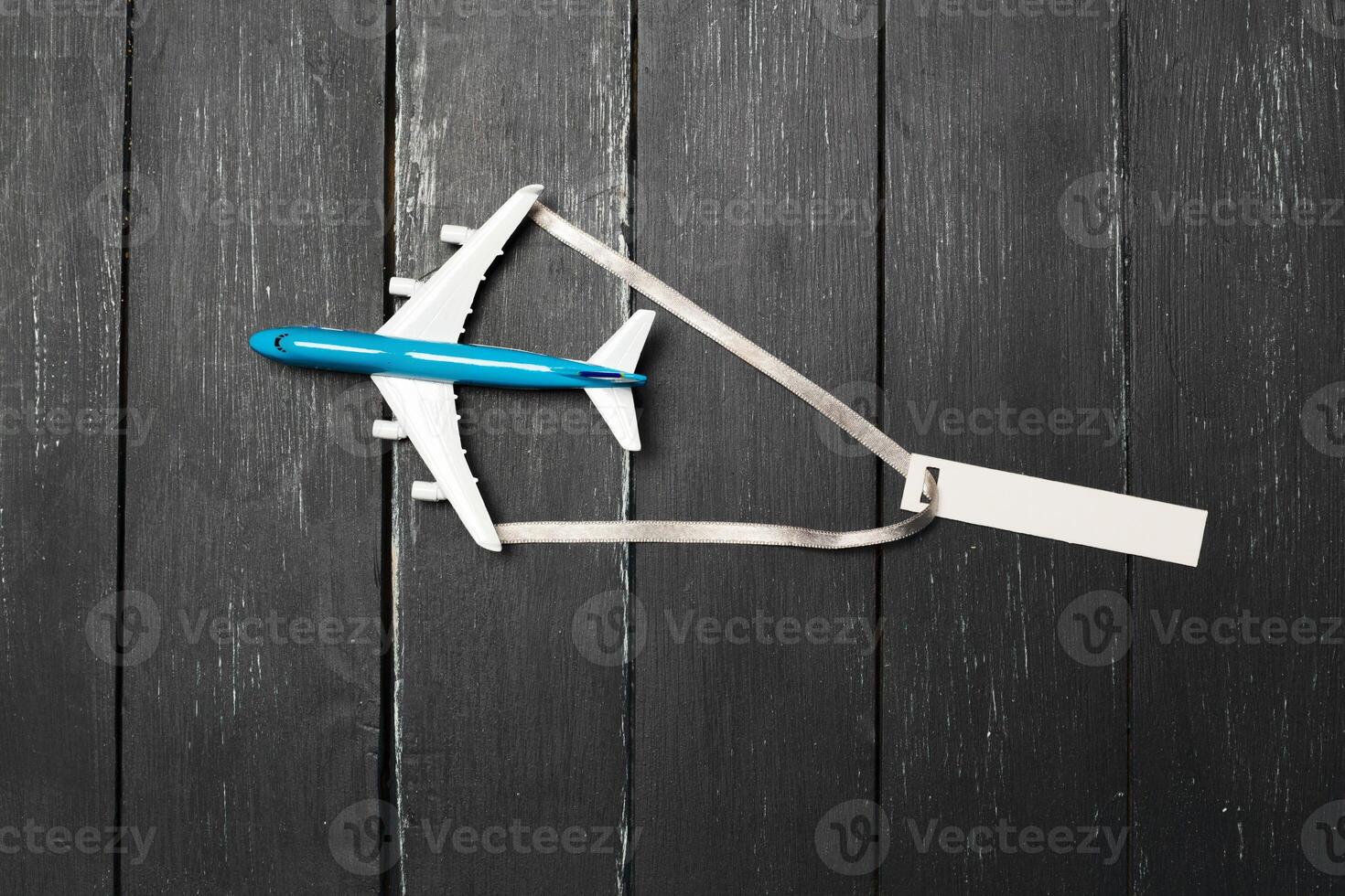 Model airplane on the wooden background photo