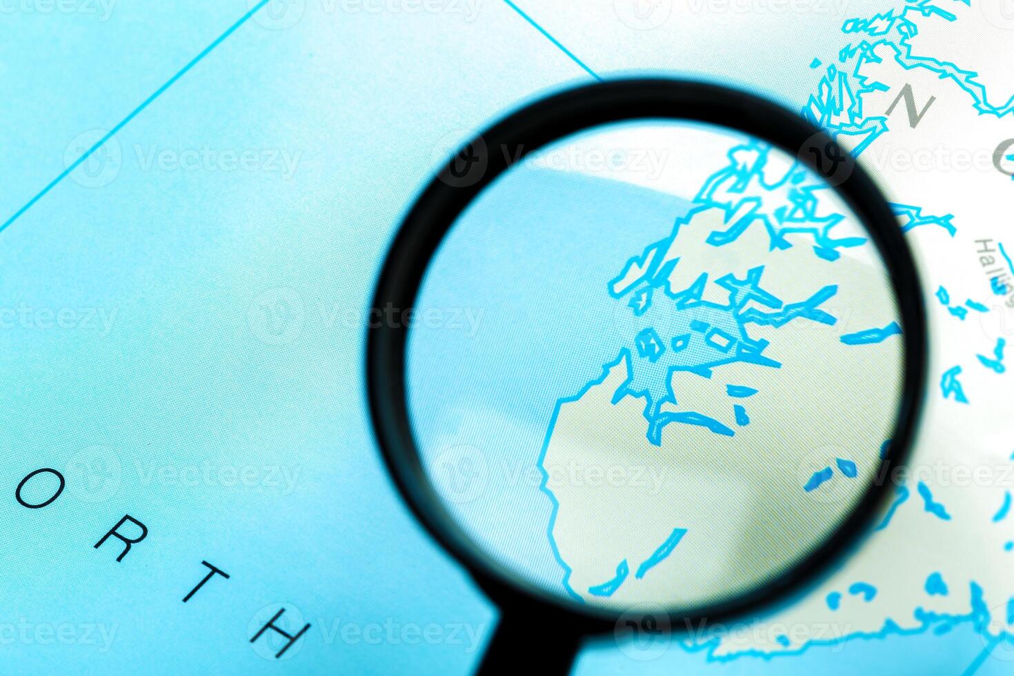 Magnifying glass and map photo