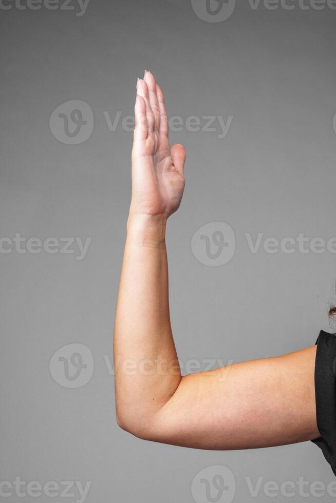 signaling a small size against a gray background photo