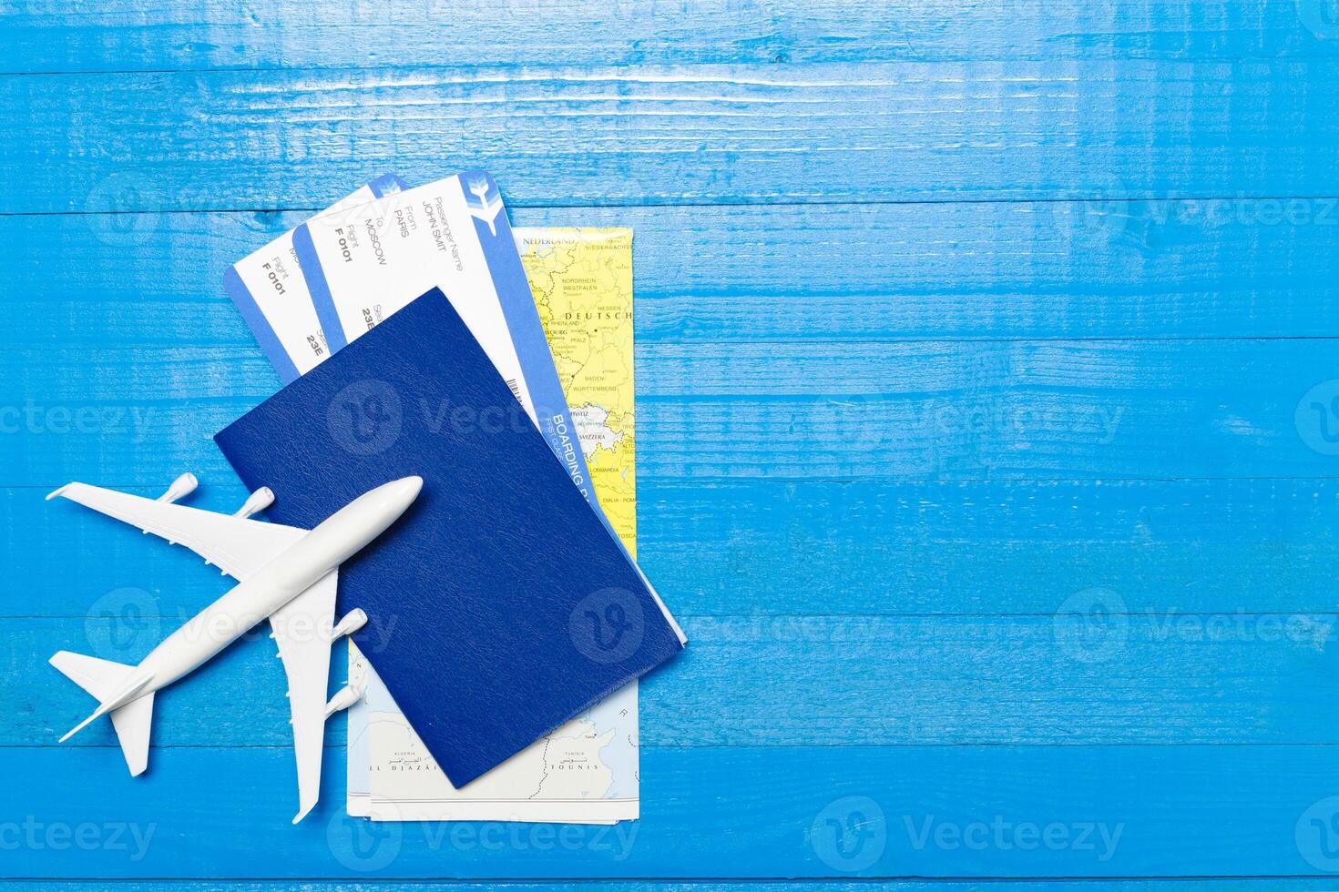 Travel objects on wooden background photo