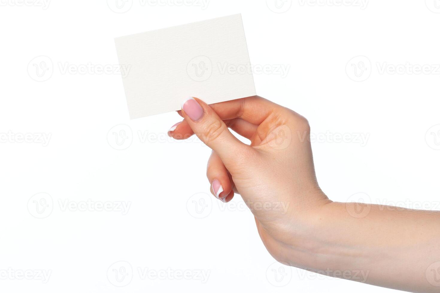 Female hand with blank white business card isolated on white photo