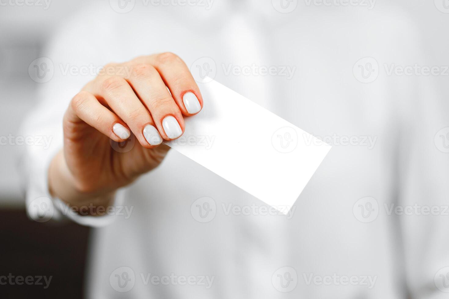 Close up of woman hotel receptionist giving you door key photo