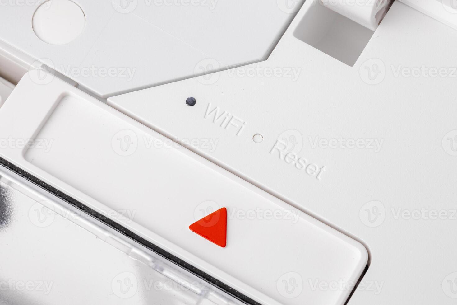 Close up of white robotic vacuum cleaner photo