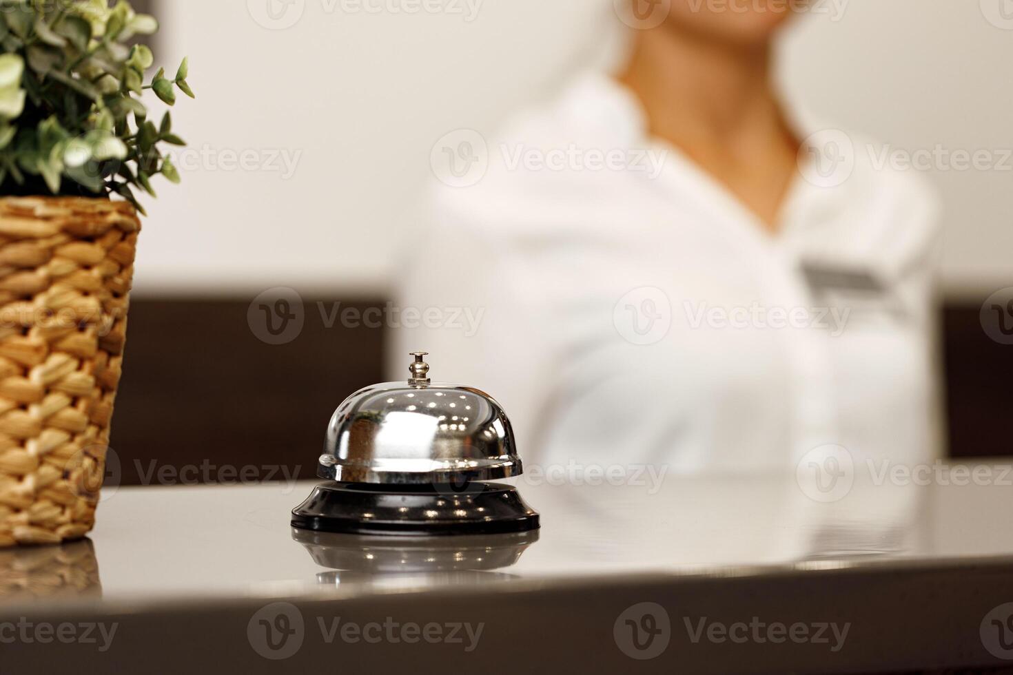 Hotel service bell on front desk counter photo