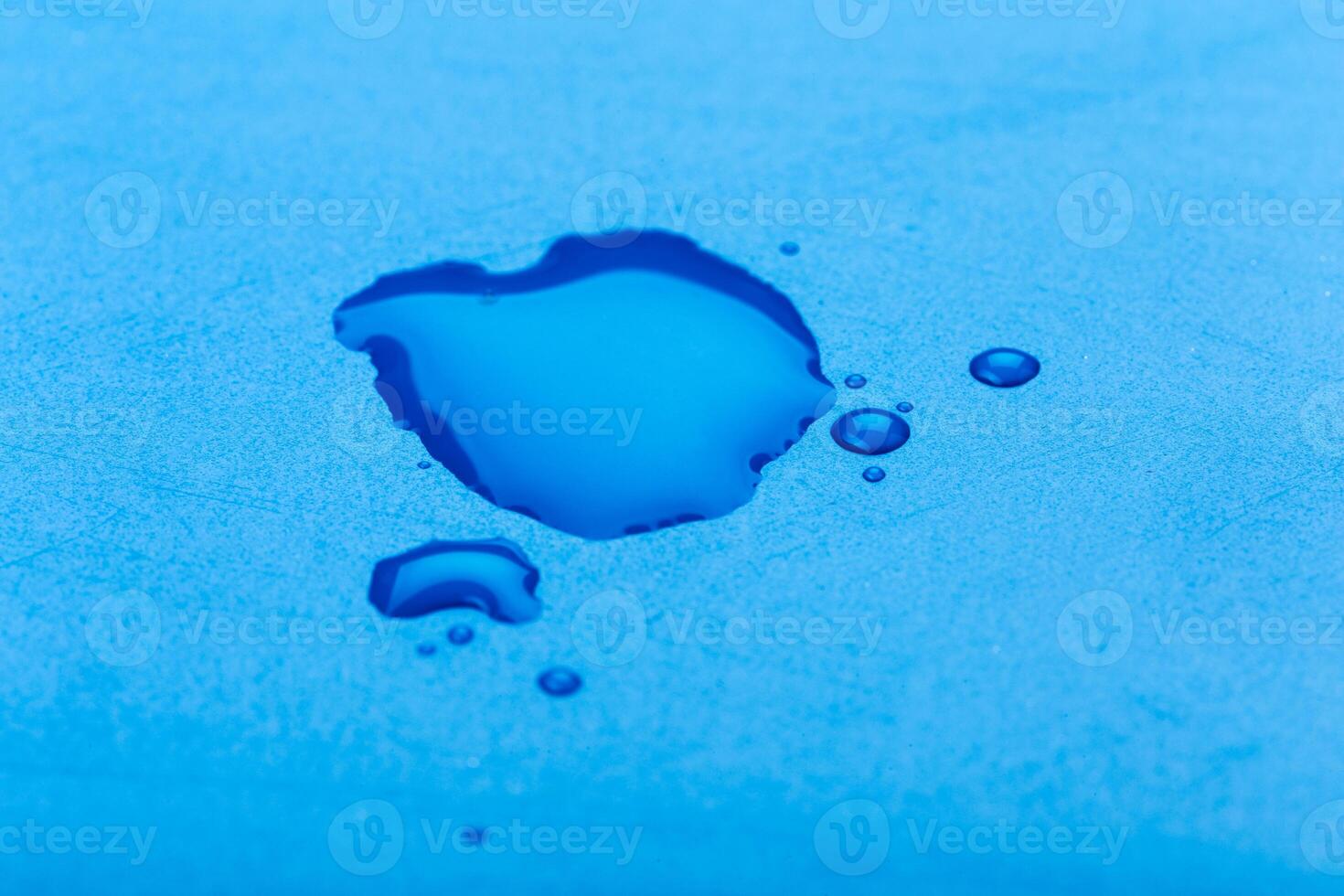 water drop on surface of fresh blue background photo
