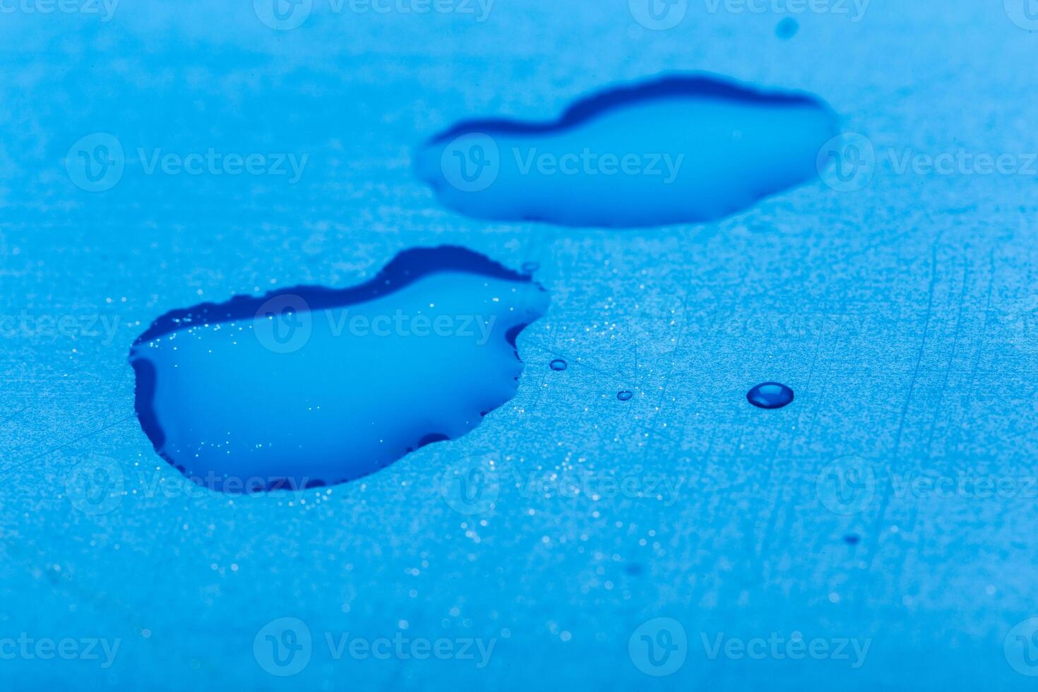 water drop on surface of fresh blue background photo